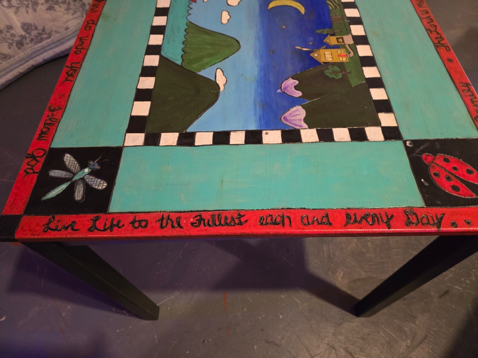 Wood burned table with artwork design