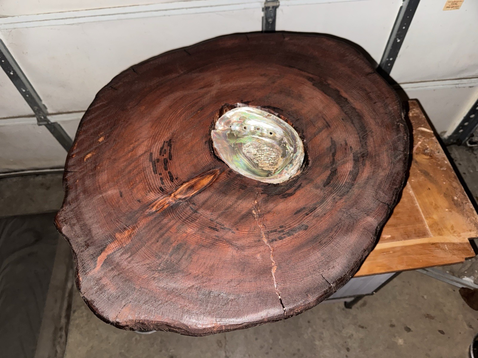 Redwood coffee table with inlaid abalone shell