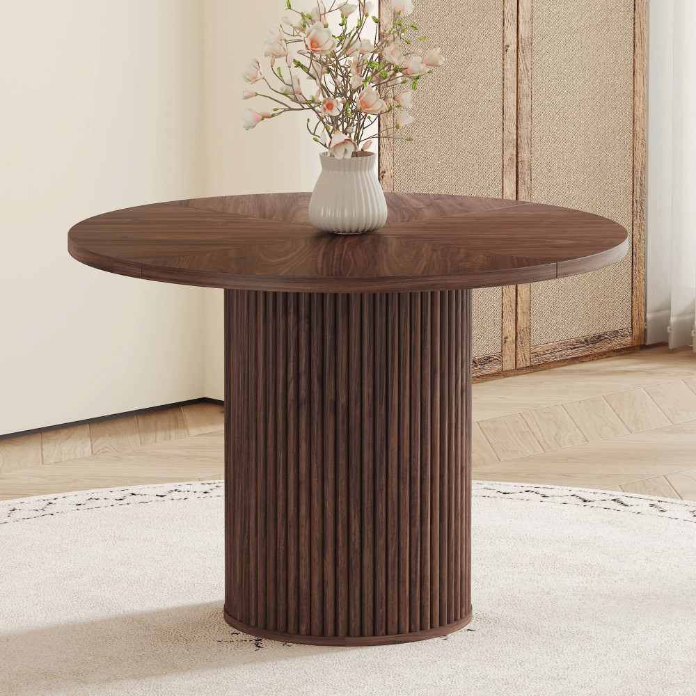 A modern spliced circular dining table with a diameter of 42 inches