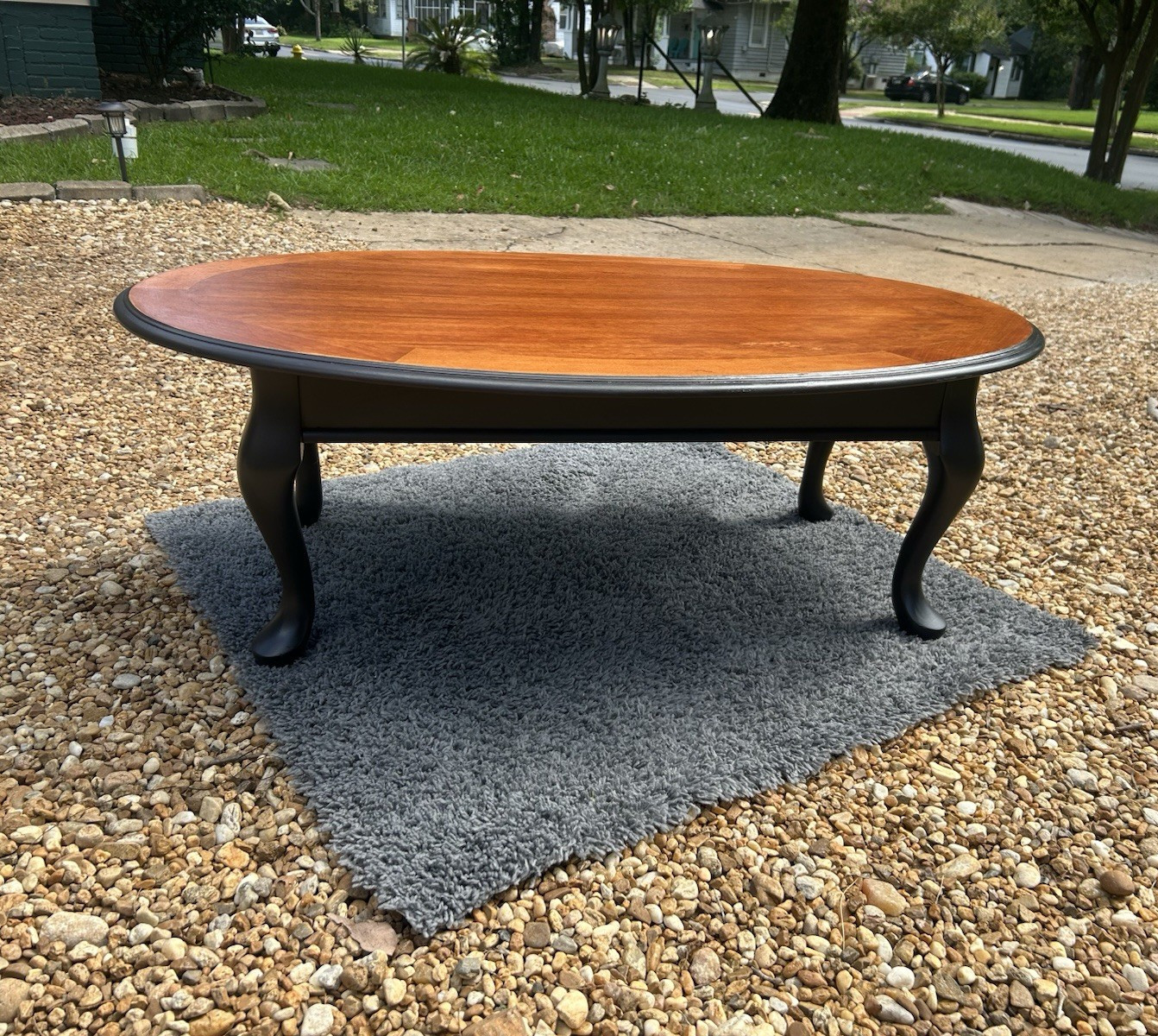 Oval Wood Coffee Table Two-Tone Brown Wood Top Black Legs 46x30x18 in Used